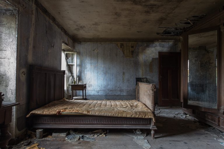 old mattress in an old and empty room