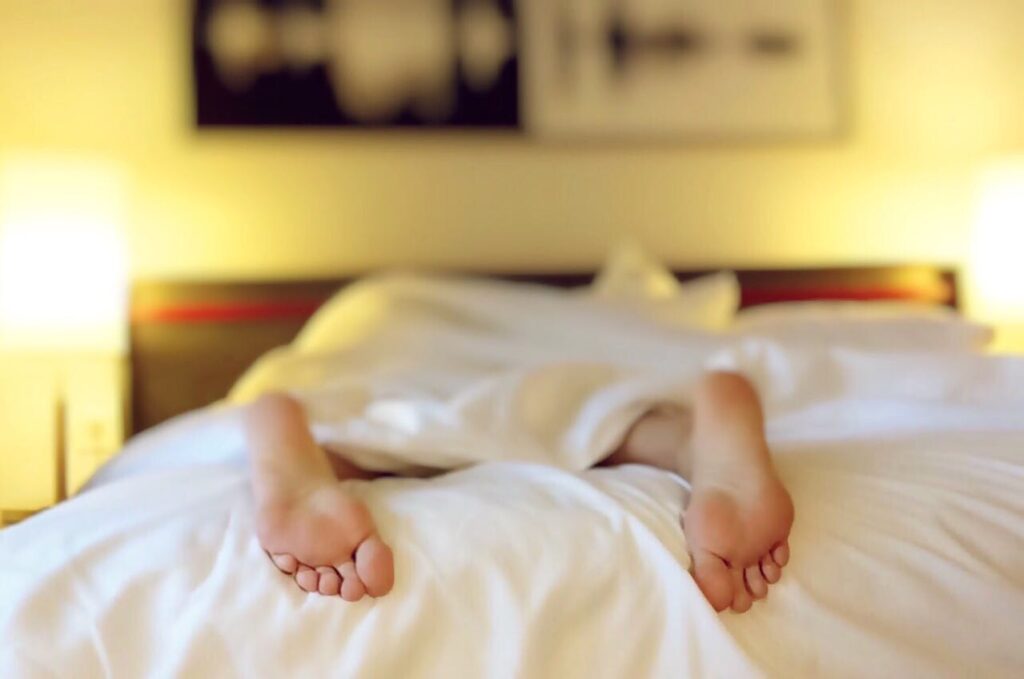 Can Your Mattress Undo Your Chiropractor's Work? The Critical Link Between Sleep Surface and Spinal Alignment 1 a person lying in bed on his stomach