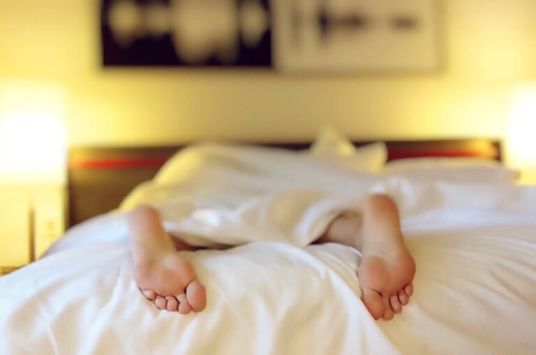 Can Your Mattress Undo Your Chiropractor's Work? The Critical Link Between Sleep Surface and Spinal Alignment 1 person lying in bed on his stomach